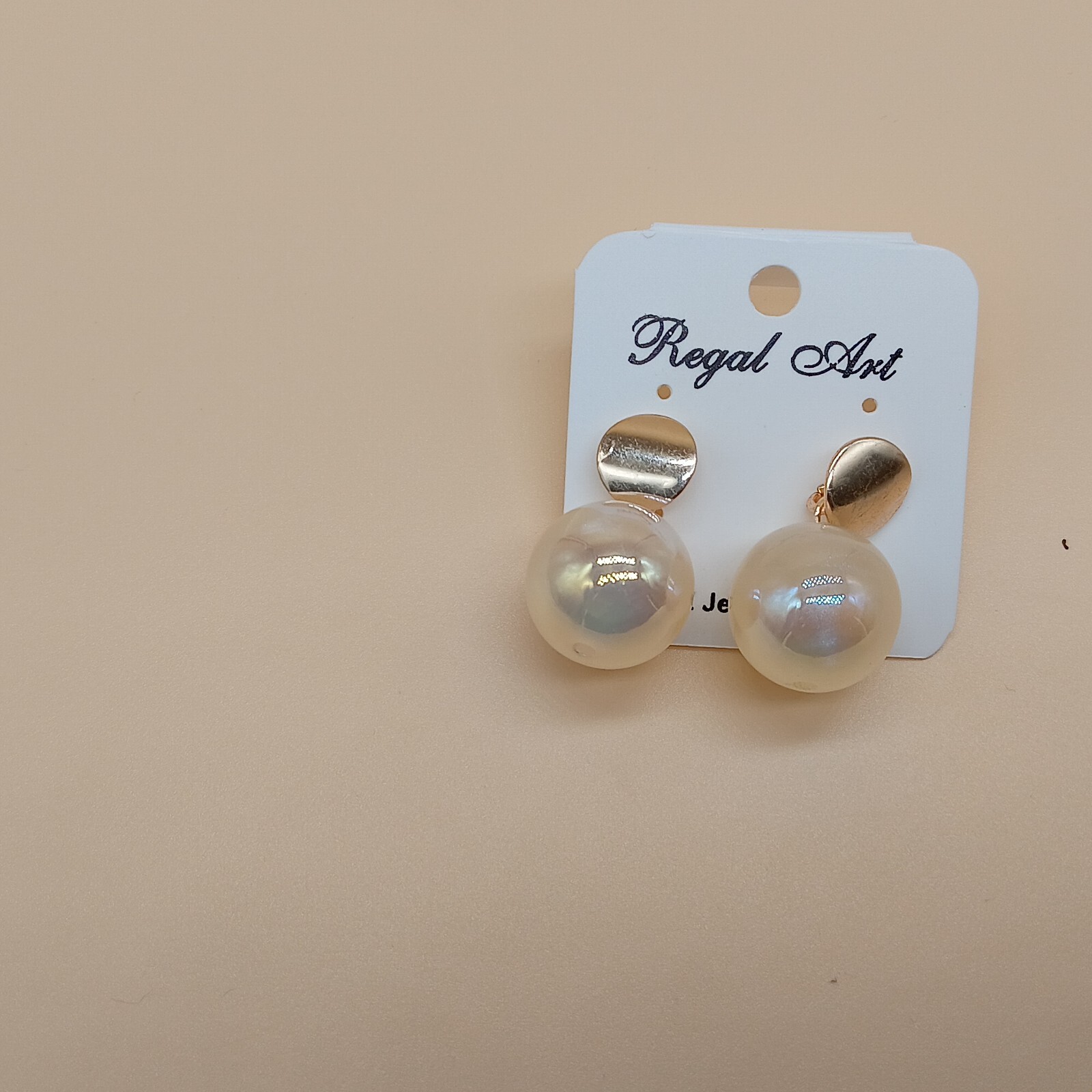 Regal Glow: Gold Half-Moon Studs with Oversized Pearls