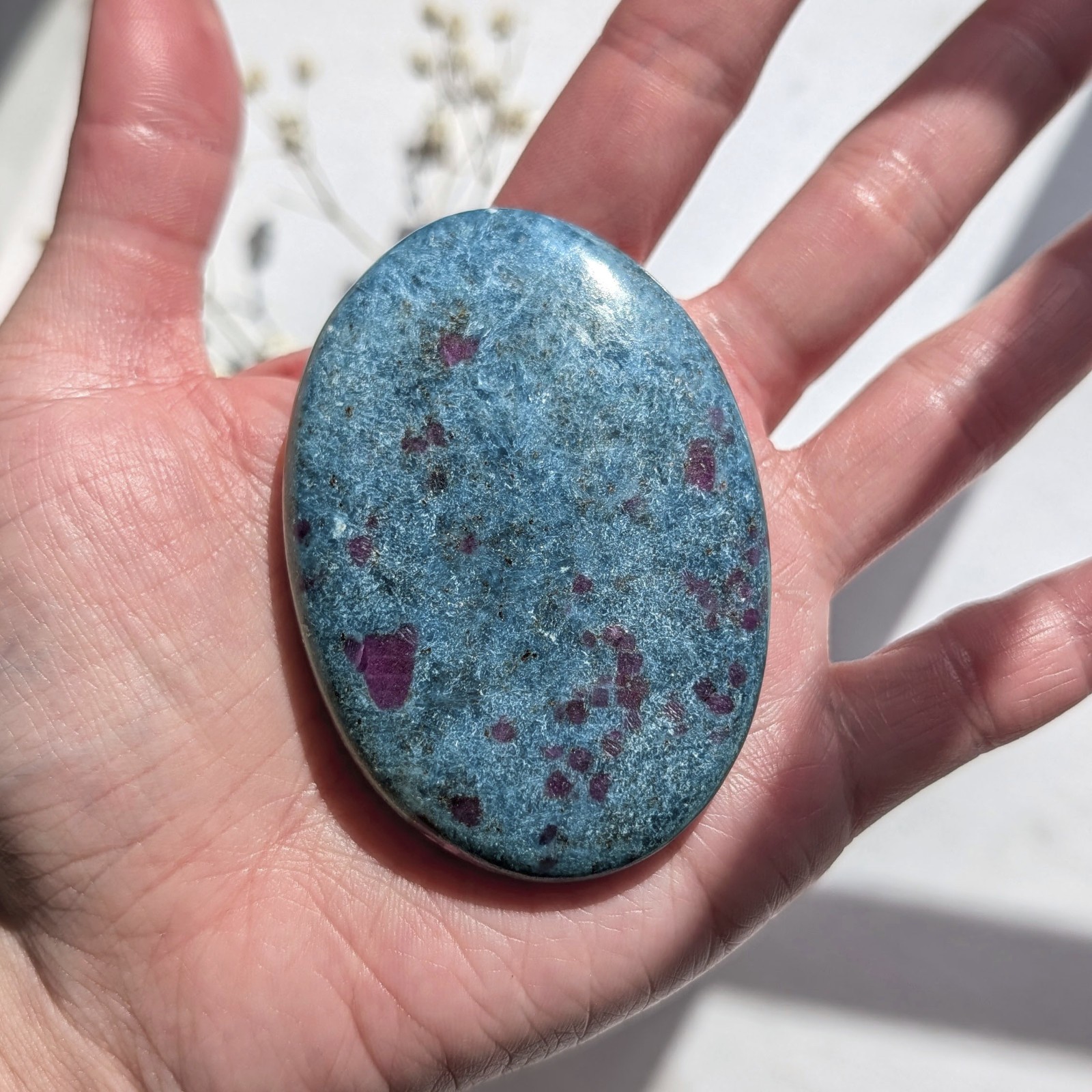 2.75″ saturated large ruby in kyanite crystal palm stone, UV reactive