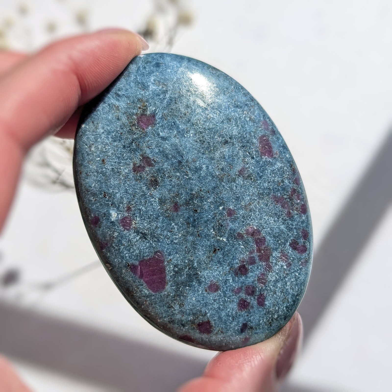 2.75″ saturated large ruby in kyanite crystal palm stone, UV reactive