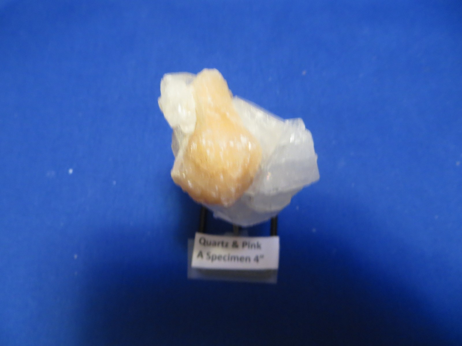 Jumbo Natural Earth Mined Quartz Crystal Pink Inclusion on Black Metal Stand