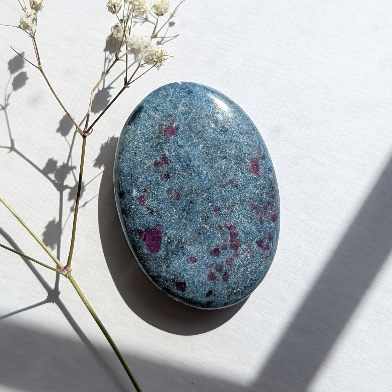 2.75″ saturated large ruby in kyanite crystal palm stone, UV reactive