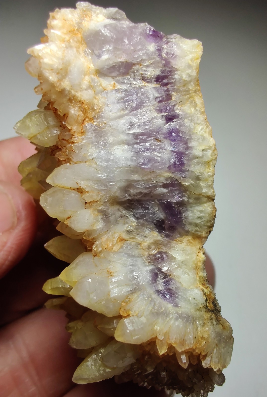 Amethyst seam with iron stained Quartz crystals. Mexico. 83 grams.