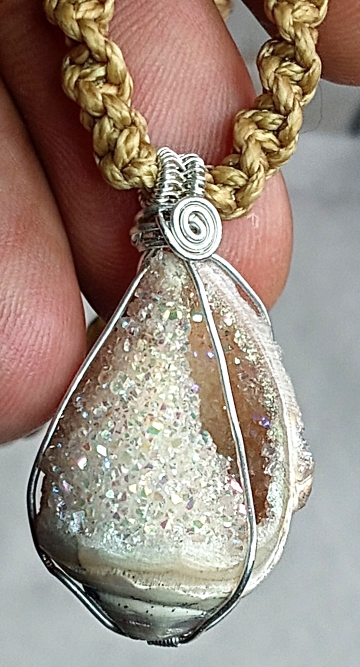 Genuine Shell fossil with Natural crystals hand braided and adjustable.