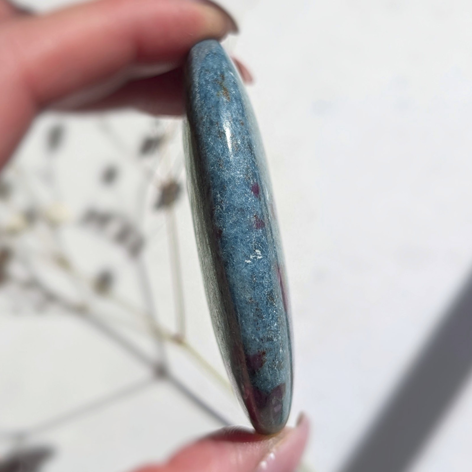 2.75″ saturated large ruby in kyanite crystal palm stone, UV reactive