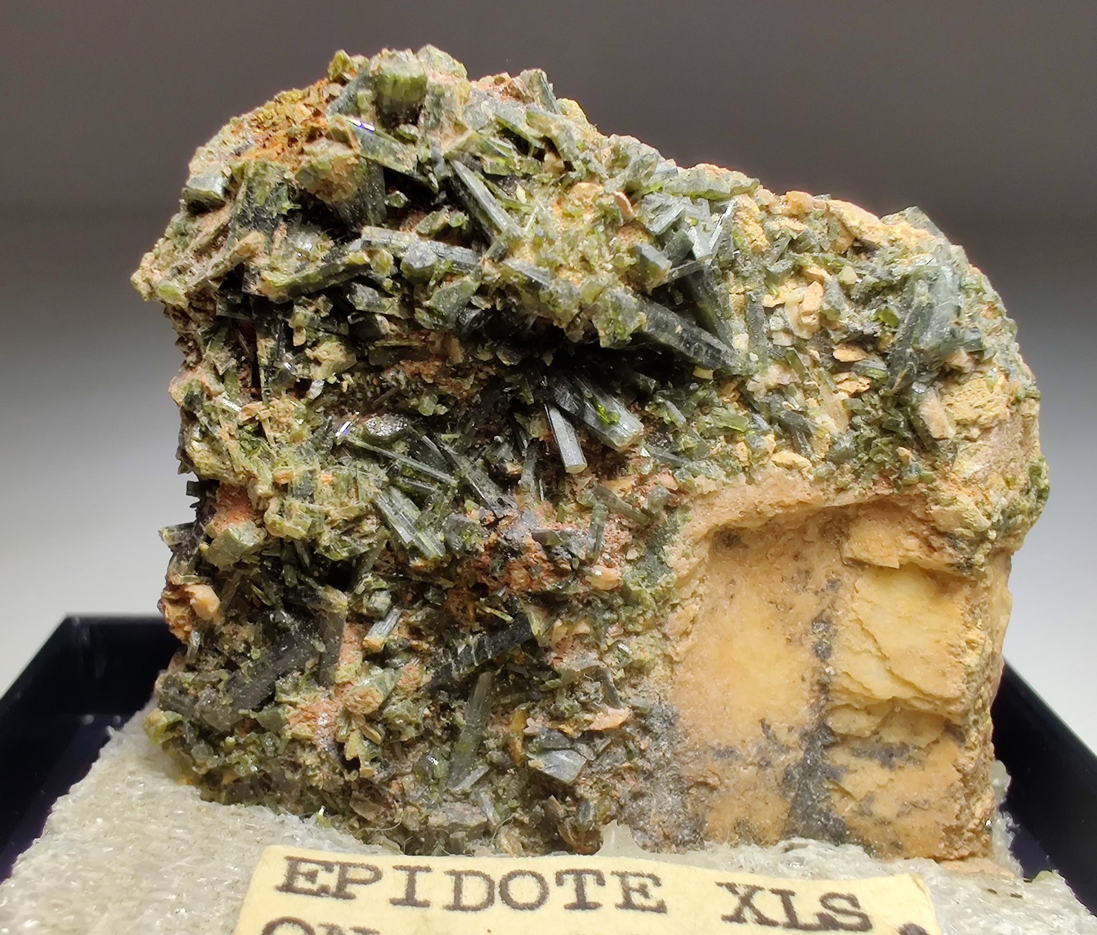 Epidote crystals on Albite. Mitchell County, North Carolina. 4 cm.