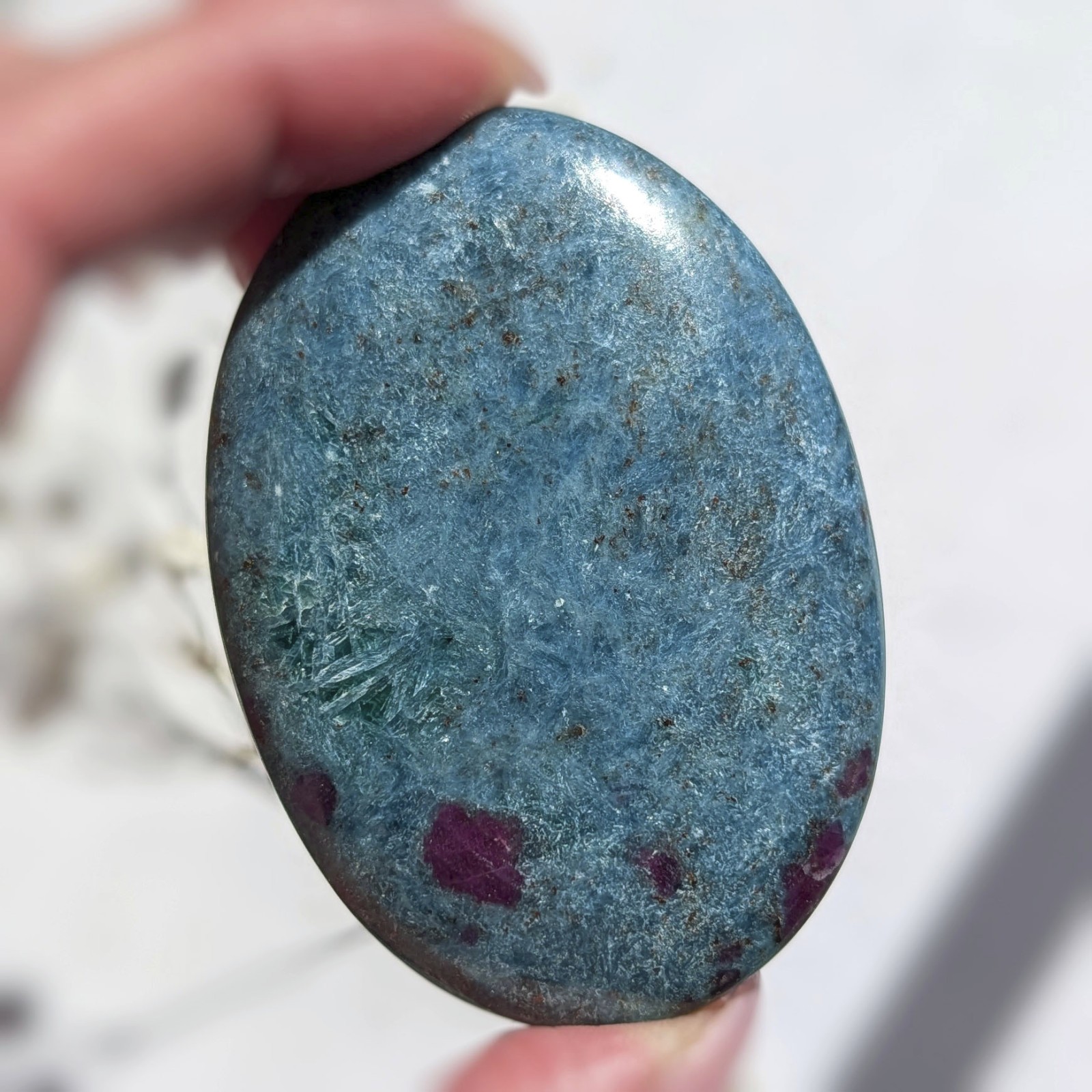 2.75″ saturated large ruby in kyanite crystal palm stone, UV reactive