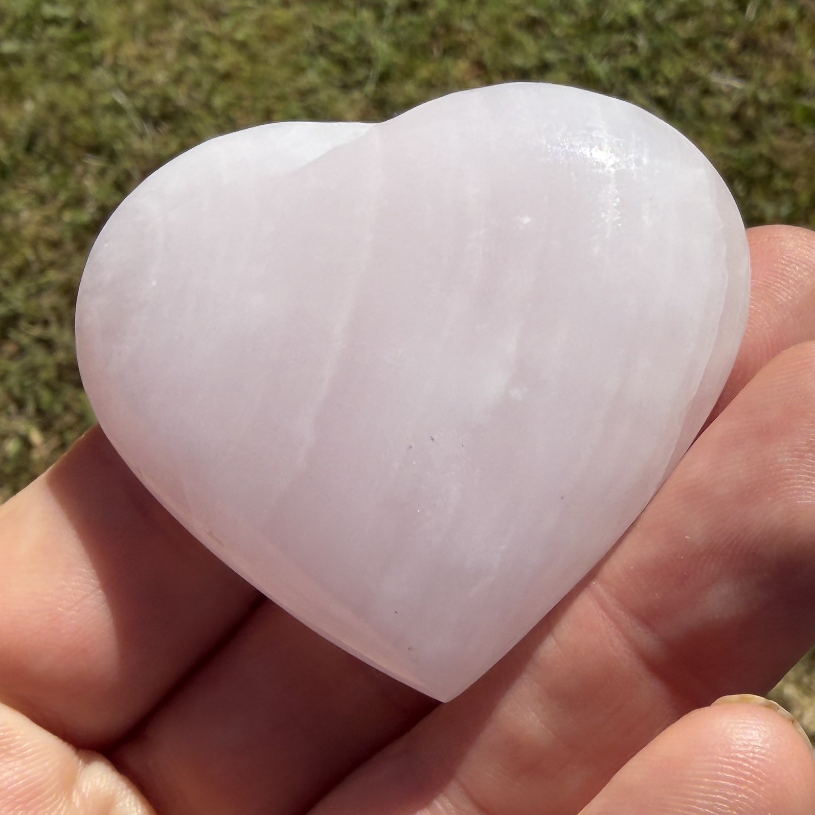 Polished Mangano Calcite Heart 71 grams approx 5.5cm X 5cm Approx UV sensitive