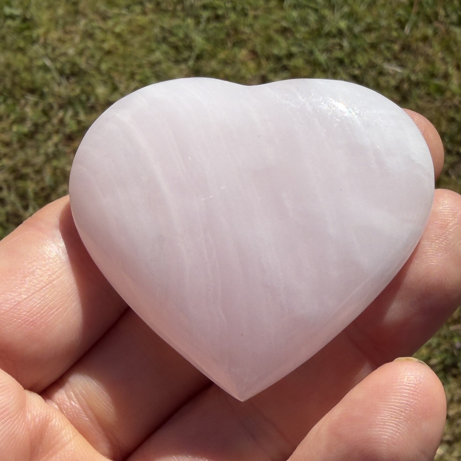 Polished Mangano Calcite Heart 71 grams approx 5.5cm X 5cm Approx UV sensitive
