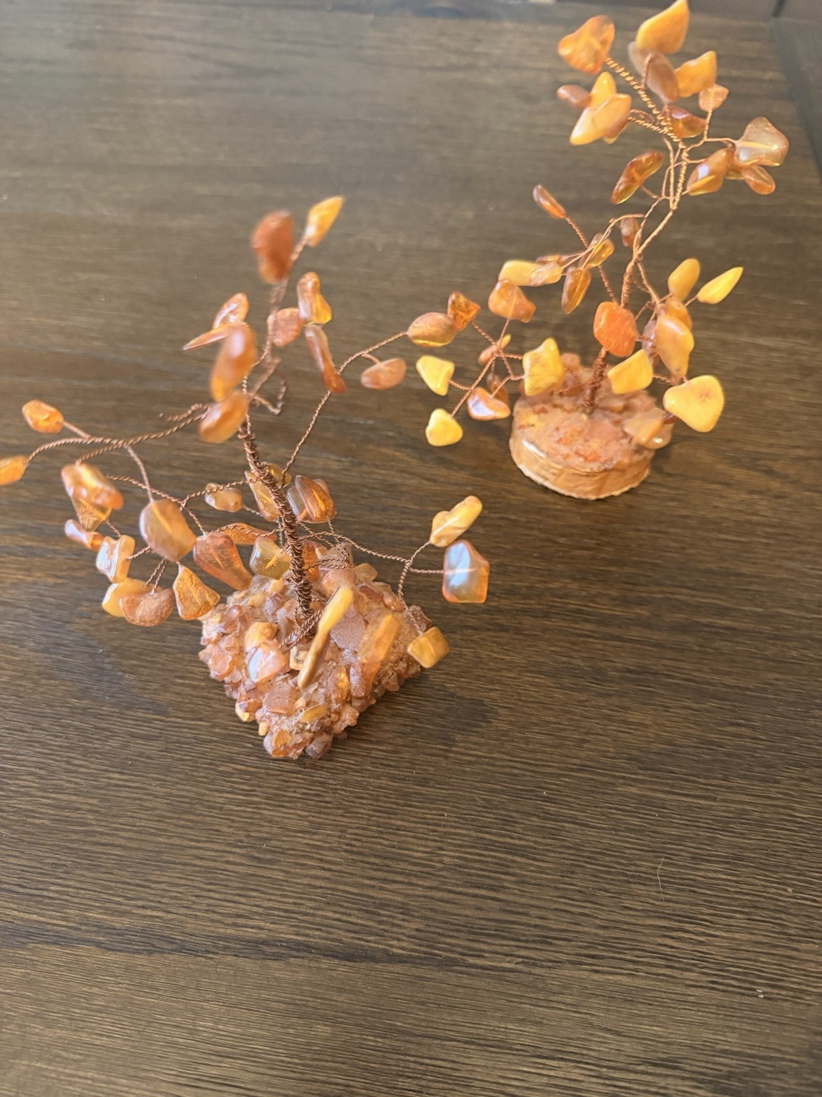 2 natural Baltic amber wire trees on wood bases. Set of two
