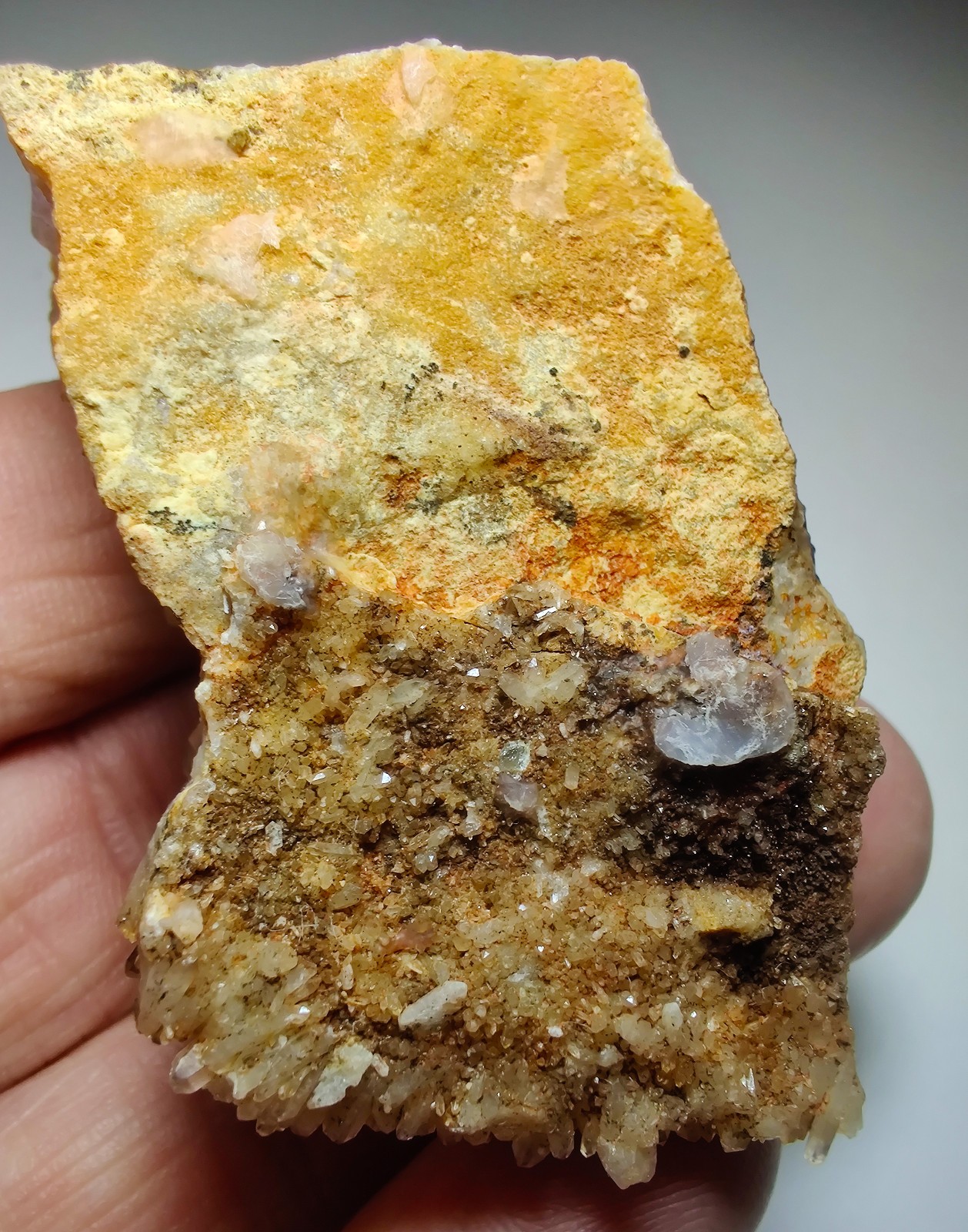 Amethyst seam with iron stained Quartz crystals. Mexico. 83 grams.