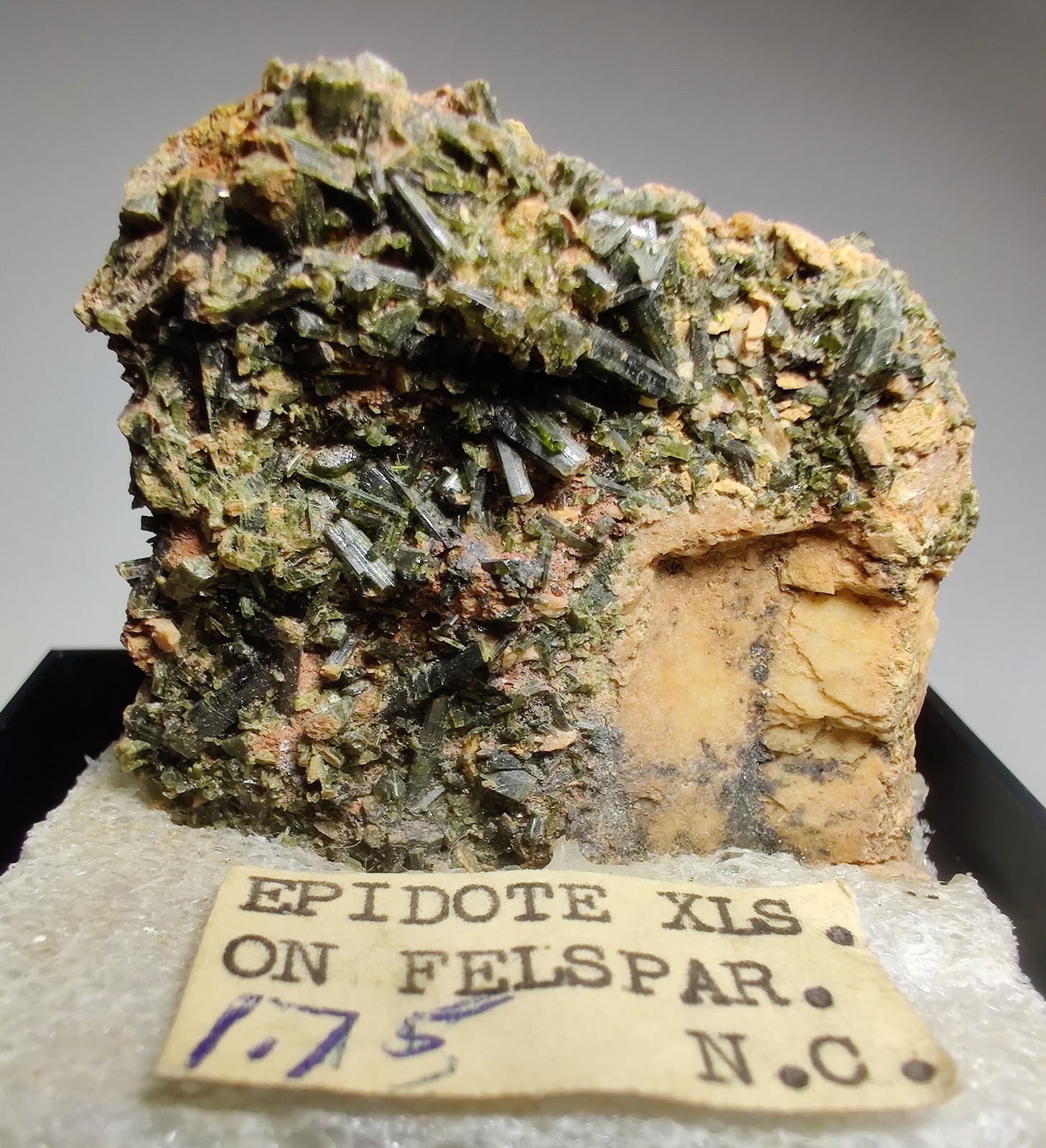 Epidote crystals on Albite. Mitchell County, North Carolina. 4 cm.
