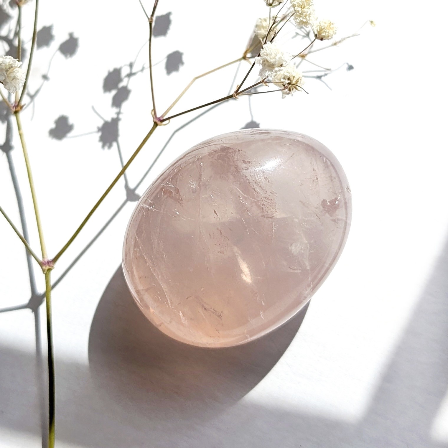 2″ translucent rose quartz palmstone with rainbow and asterism, star rose quartz
