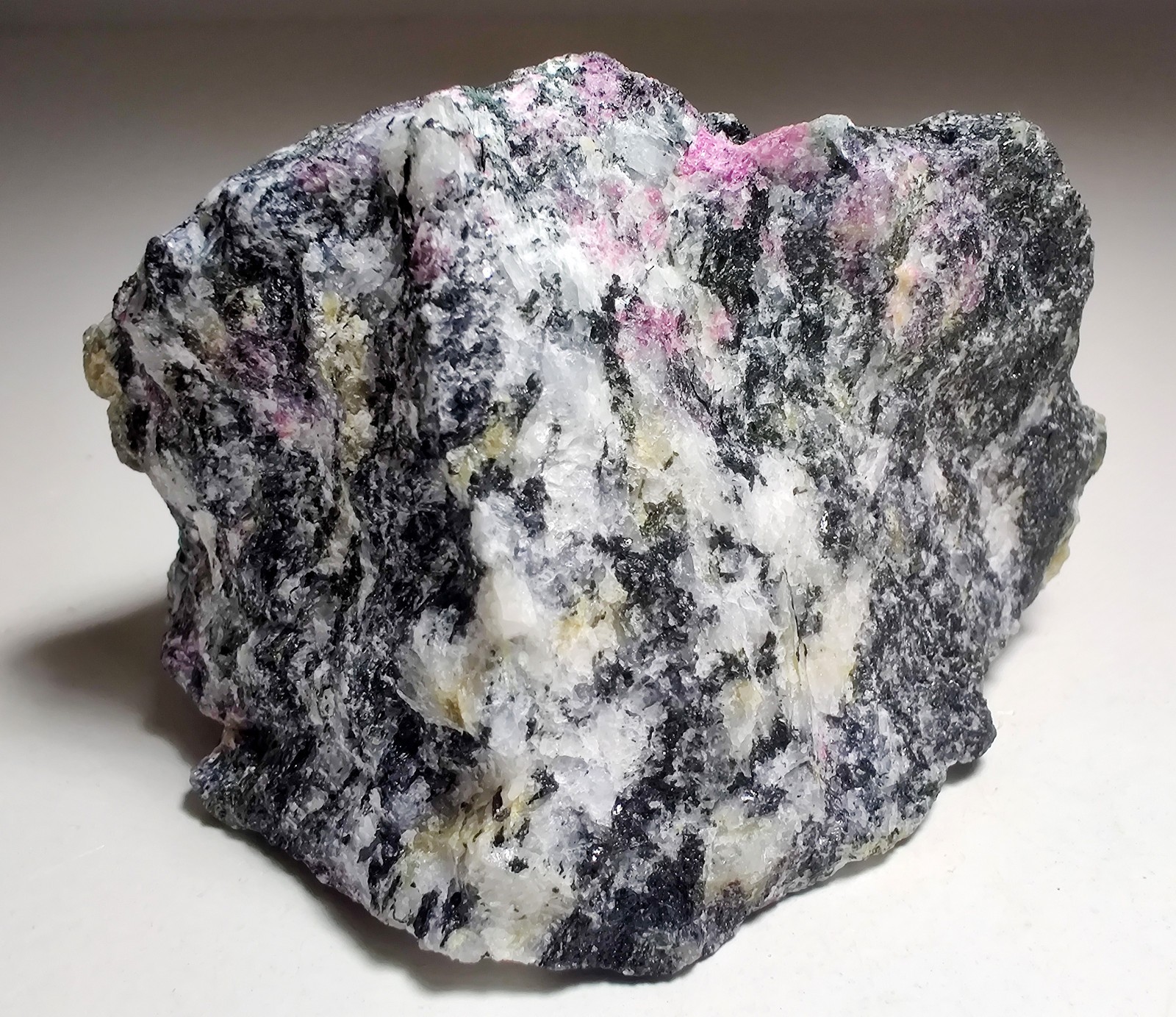 Eudialyte in Syenite and other rare minerals. Norra karr, Sweden. 166 grams.