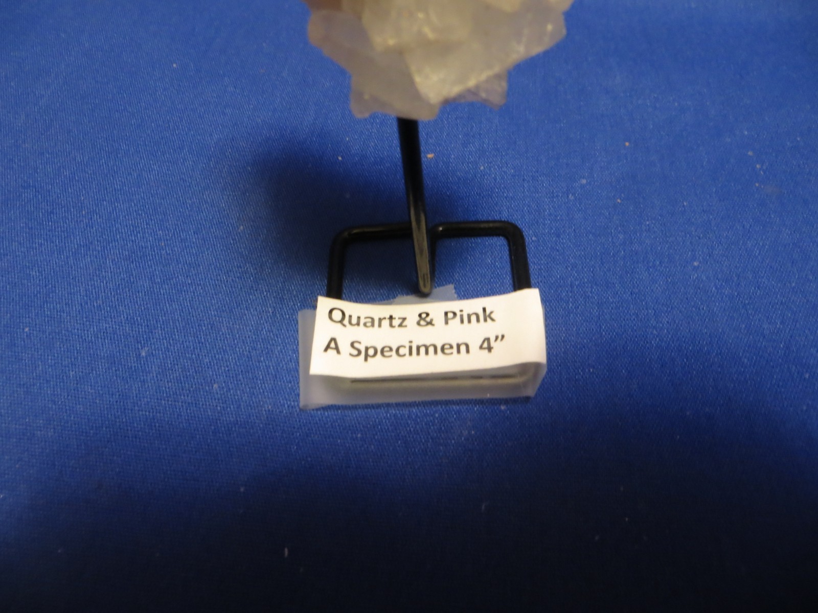 Jumbo Natural Earth Mined Quartz Crystal Pink Inclusion on Black Metal Stand